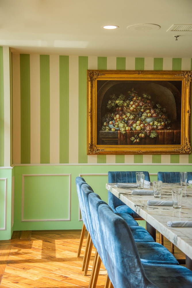 Semi-private dining room set for party with blue chairs